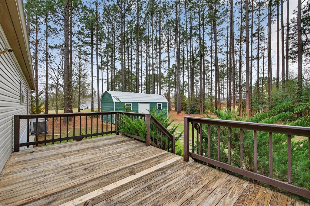 8794 Castle Dale Loop Shreveport, LA 71107 - Photo 29 of 31 Wooden terrace featuring an 12 x 24 workshop outdoor structure