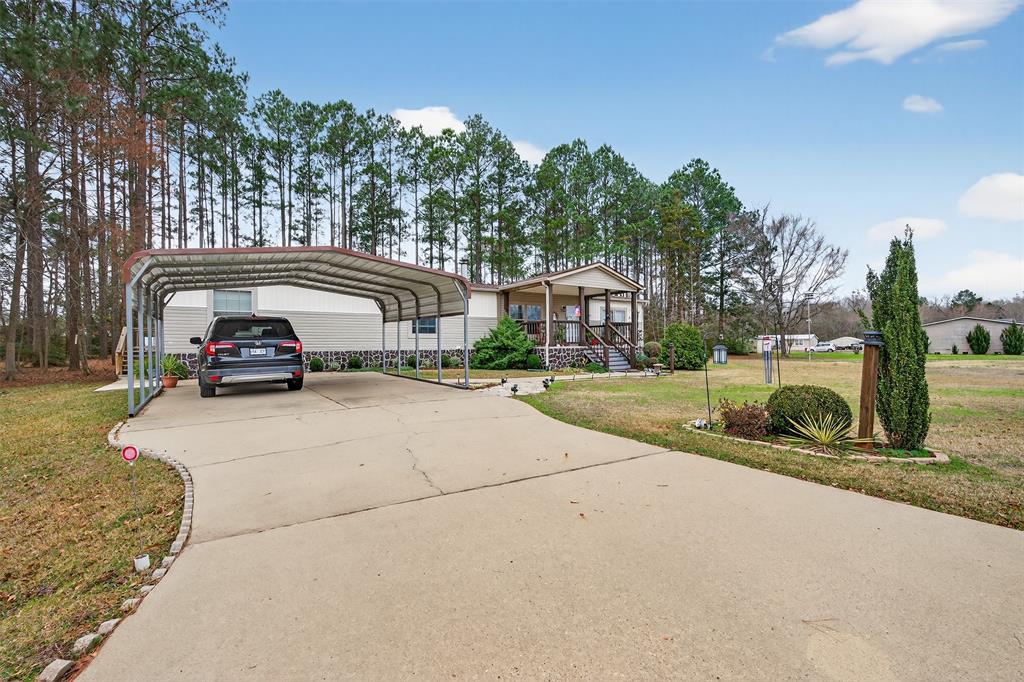 8794 Castle Dale Loop Shreveport, LA 71107 - Photo 5 of 31 2 Car Covered Carport with paved driveway