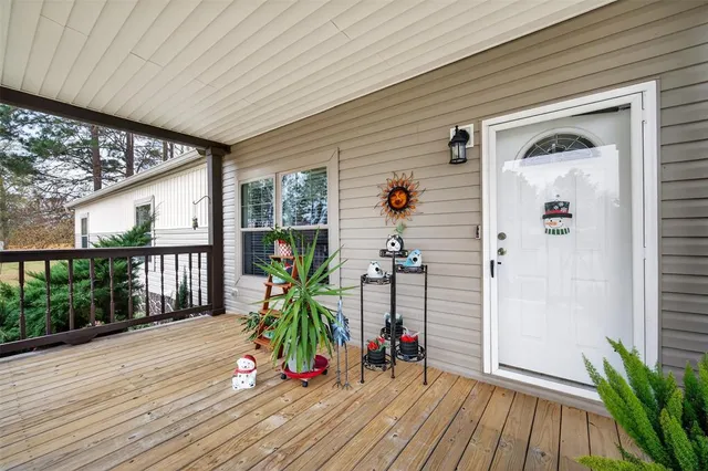 a view of an entryway with wooden floor
