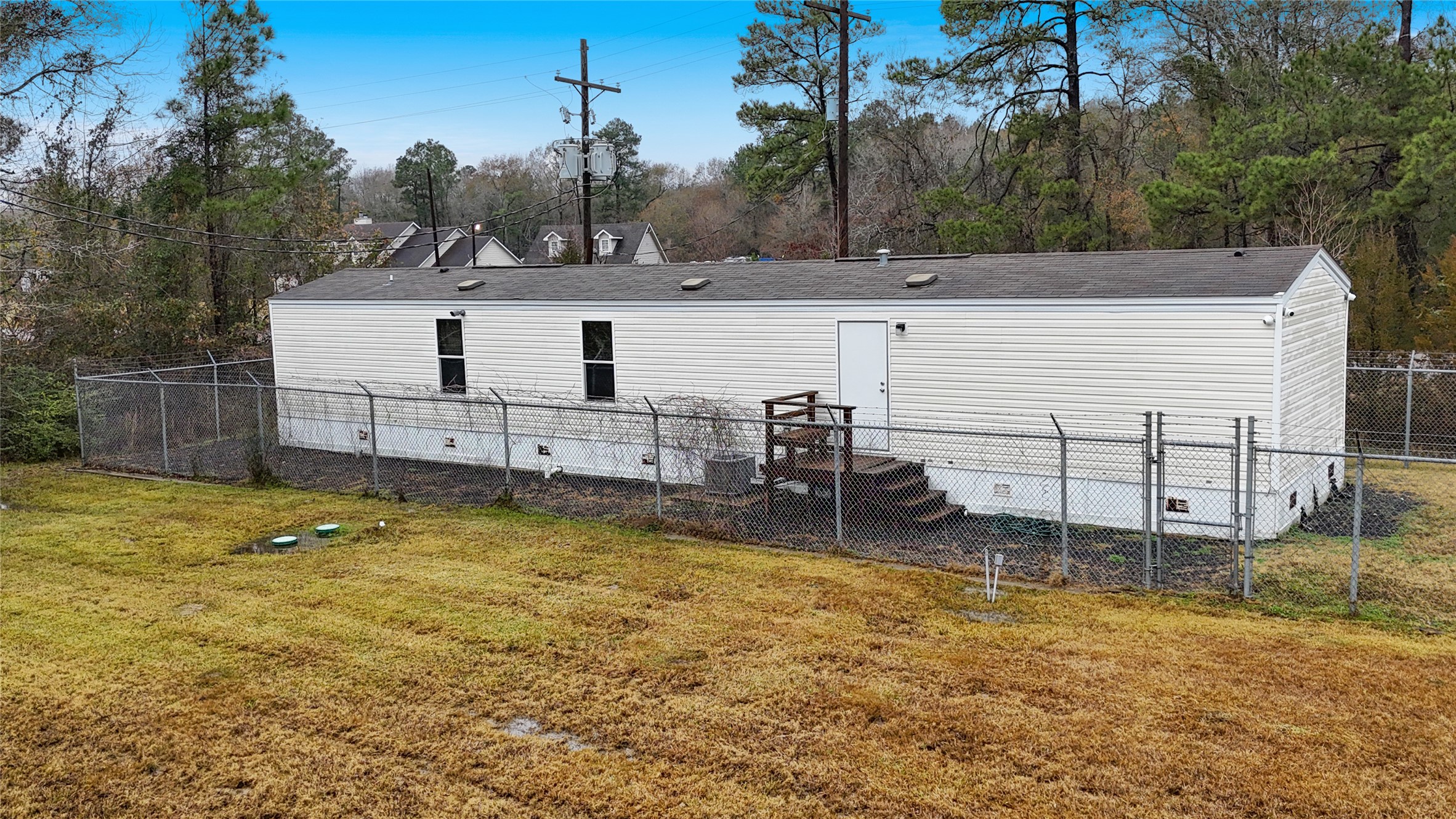 21405 Farm To Market 787 Cleveland, TX 77327 - Photo 16 of 24 The mobile home is 3 bed/ 2 bath with a full kitchen and laundry room. It is secured with a fence. Perfect for office or a caretaker to live.