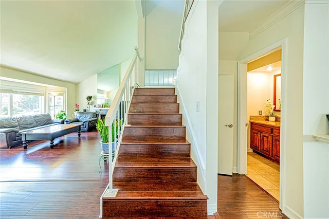 a view of entryway and hall with wooden floor