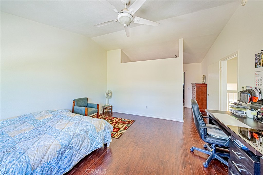 49 Stagecoach Drive Phillips Ranch, CA 91766 - Photo 21 of 39 a bedroom with a bed and a wooden floor