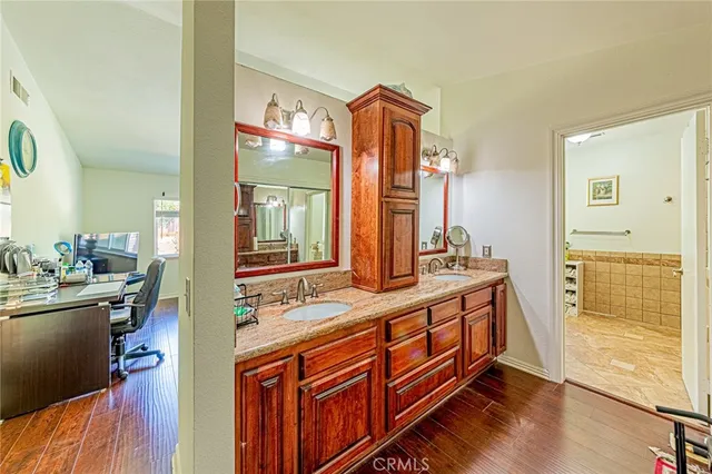 a bathroom with a sink a vanity and a mirror