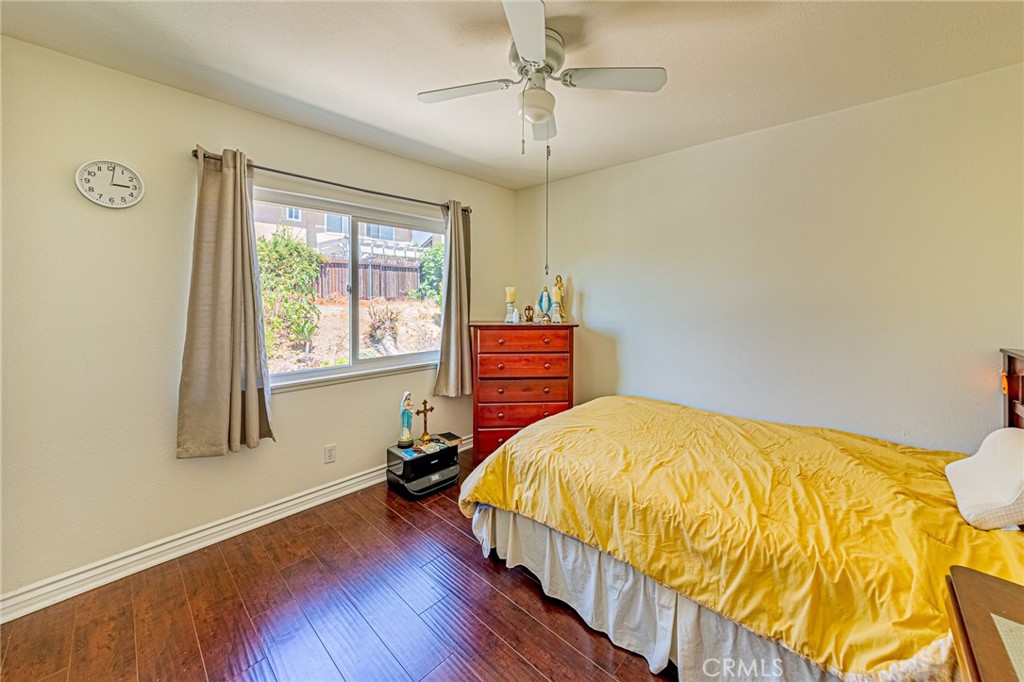 49 Stagecoach Drive Phillips Ranch, CA 91766 - Photo 26 of 39 a bedroom with a bed and wooden floor