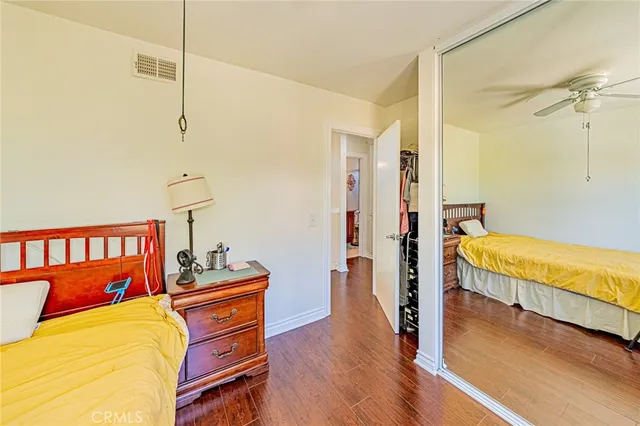 a bedroom with a bed and a table in it