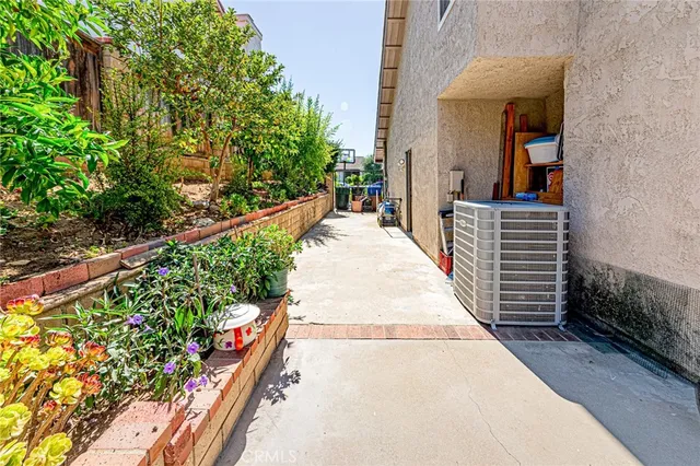 a view of a pathway along the path and flowers
