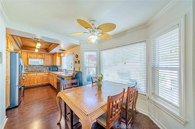 a view of a dining room with furniture and a window