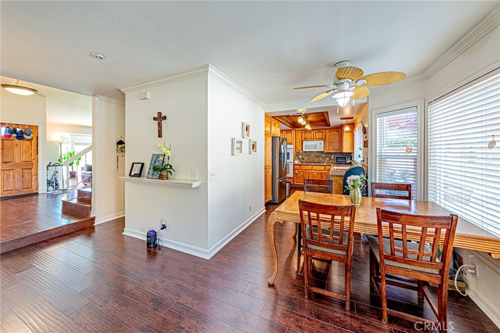 49 Stagecoach Drive Phillips Ranch, CA 91766 - Photo 10 of 39 a view of a dining room with furniture and wooden floor