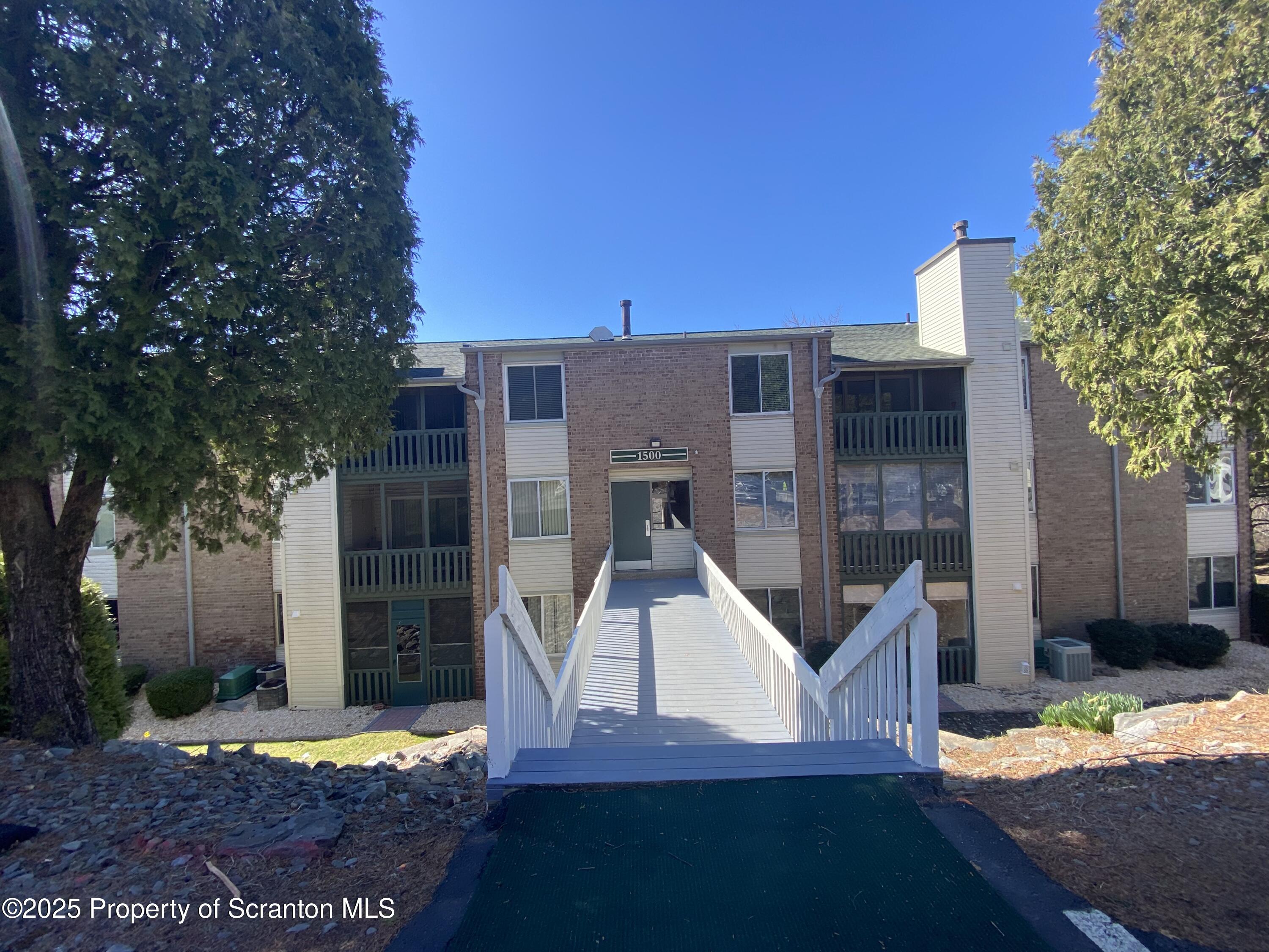 front view of a house with a patio