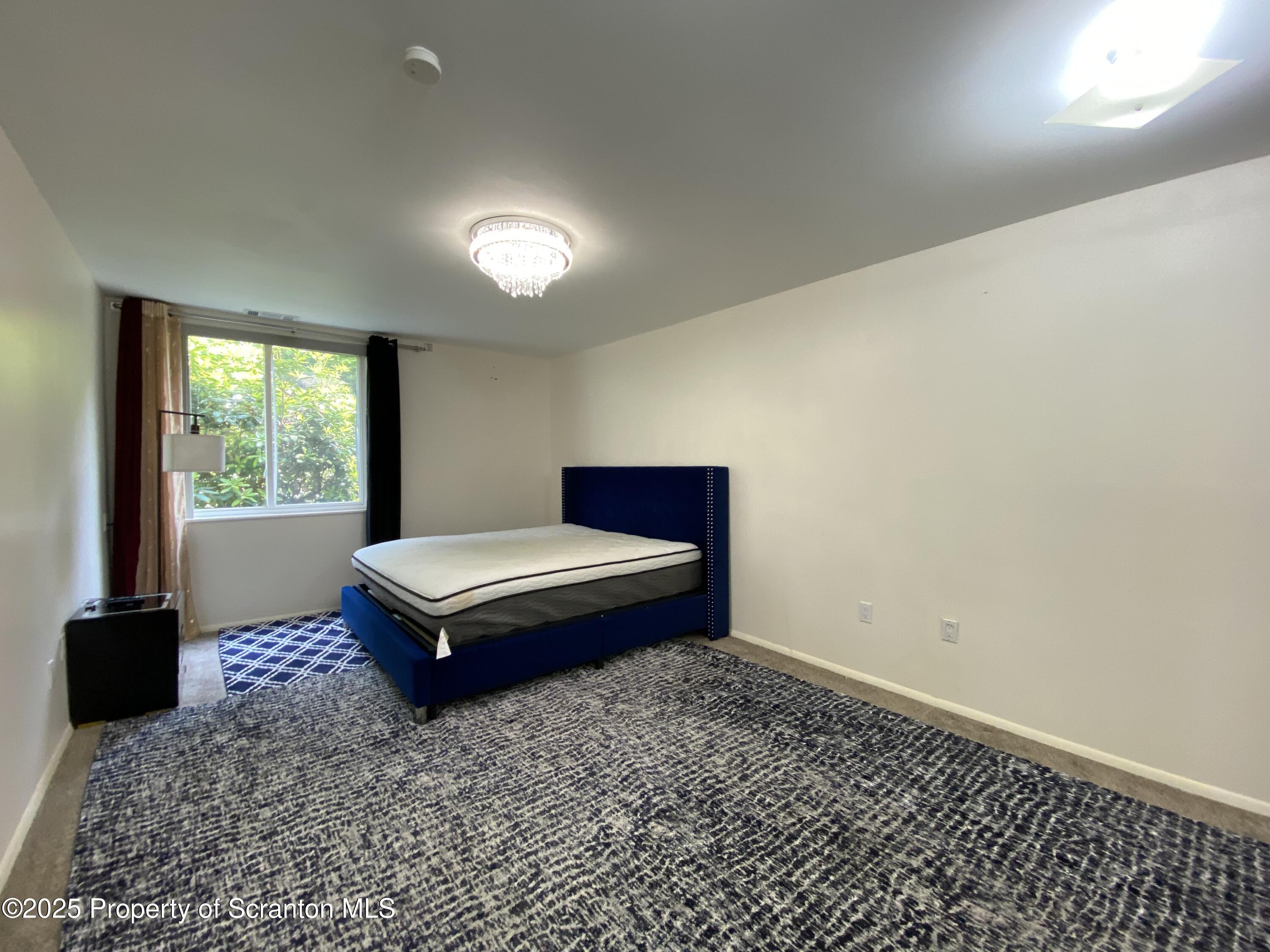 1501 Summit Pointe Scranton, PA 18508 - Photo 17 of 34 a bedroom with a bed and window