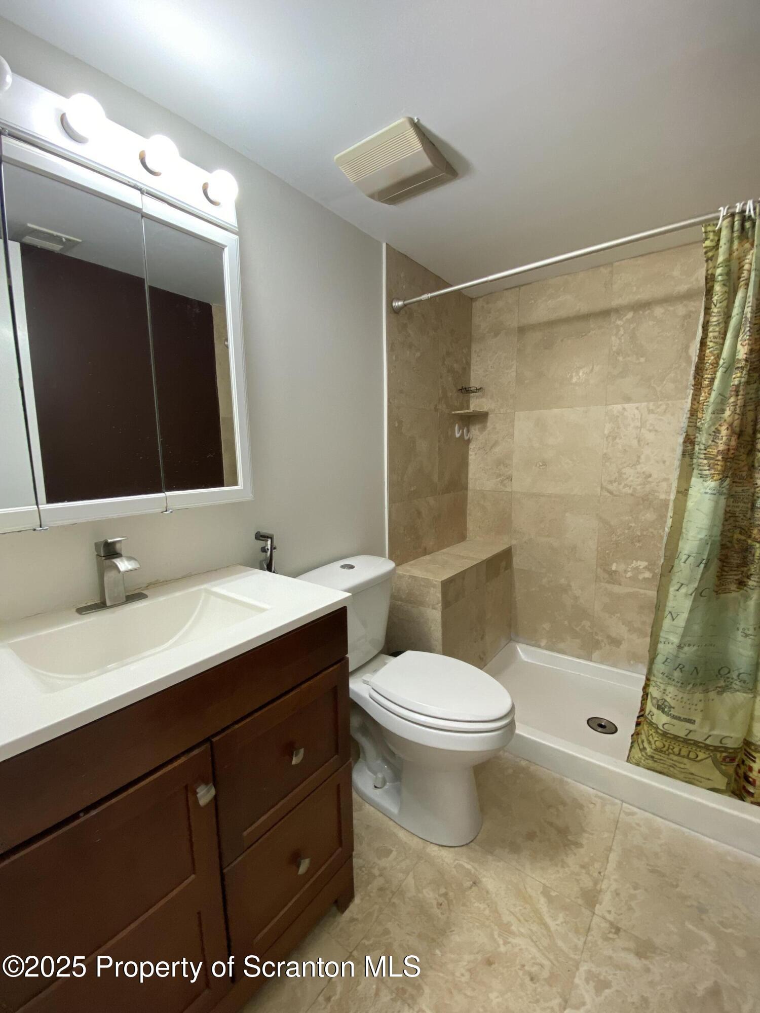 1501 Summit Pointe Scranton, PA 18508 - Photo 20 of 34 a bathroom with a sink and a mirror