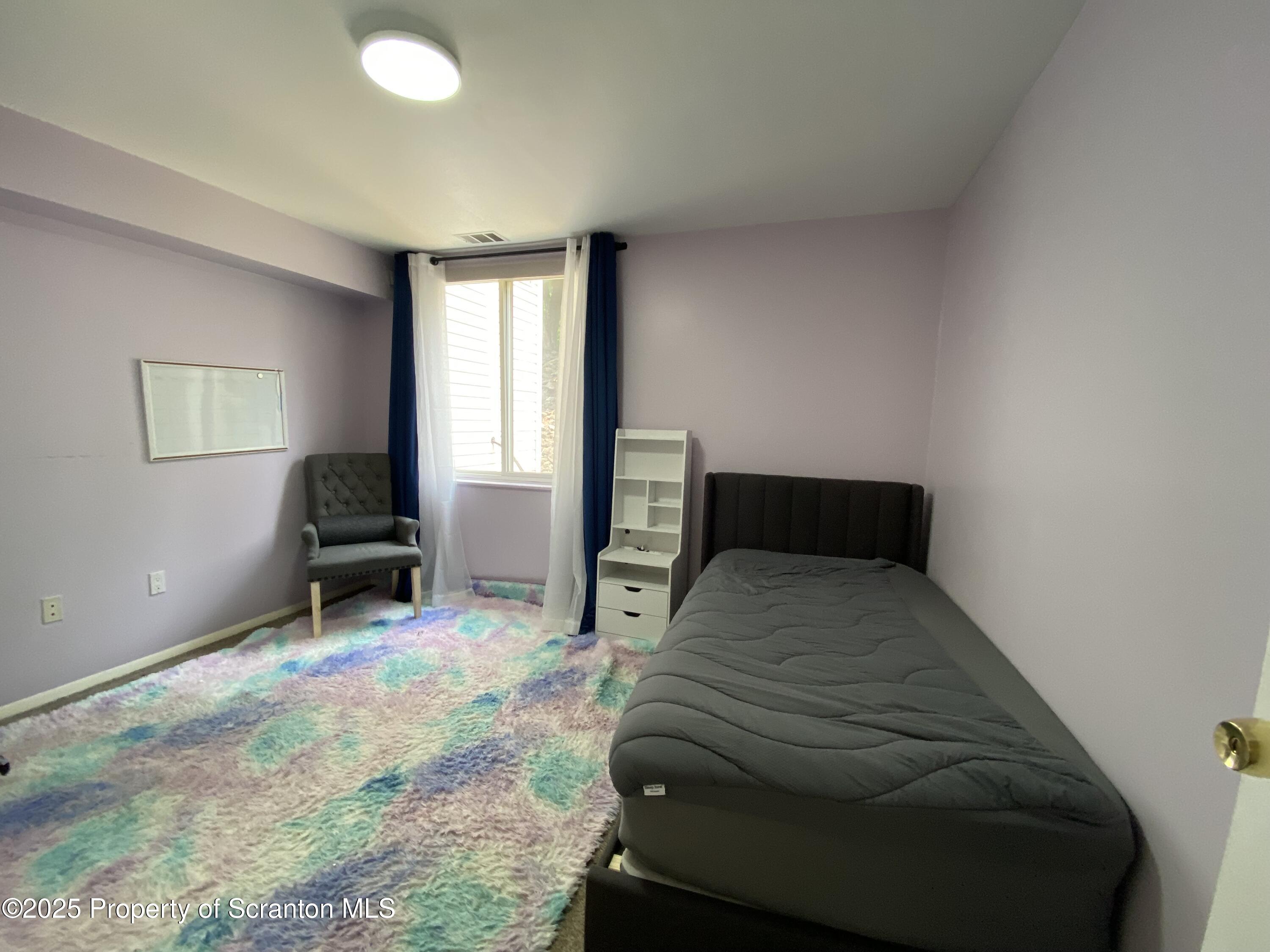 1501 Summit Pointe Scranton, PA 18508 - Photo 23 of 34 a bedroom with a bed and a window