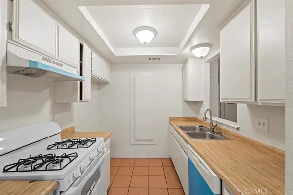 a kitchen with a stove and a sink