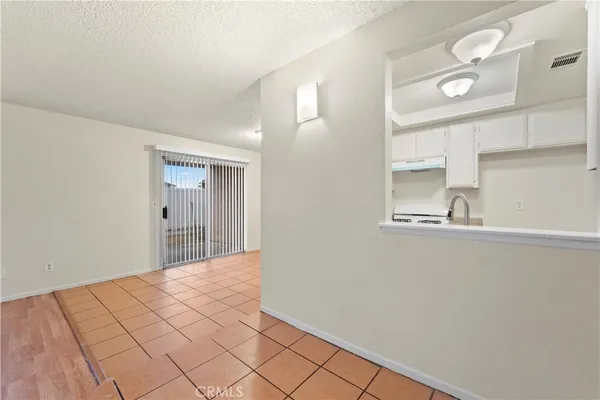 a view of a kitchen cabinets and empty room