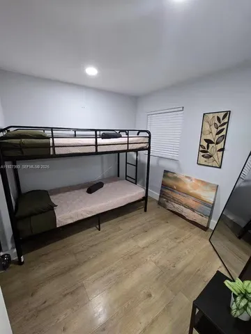 a living room with a bed and a couch