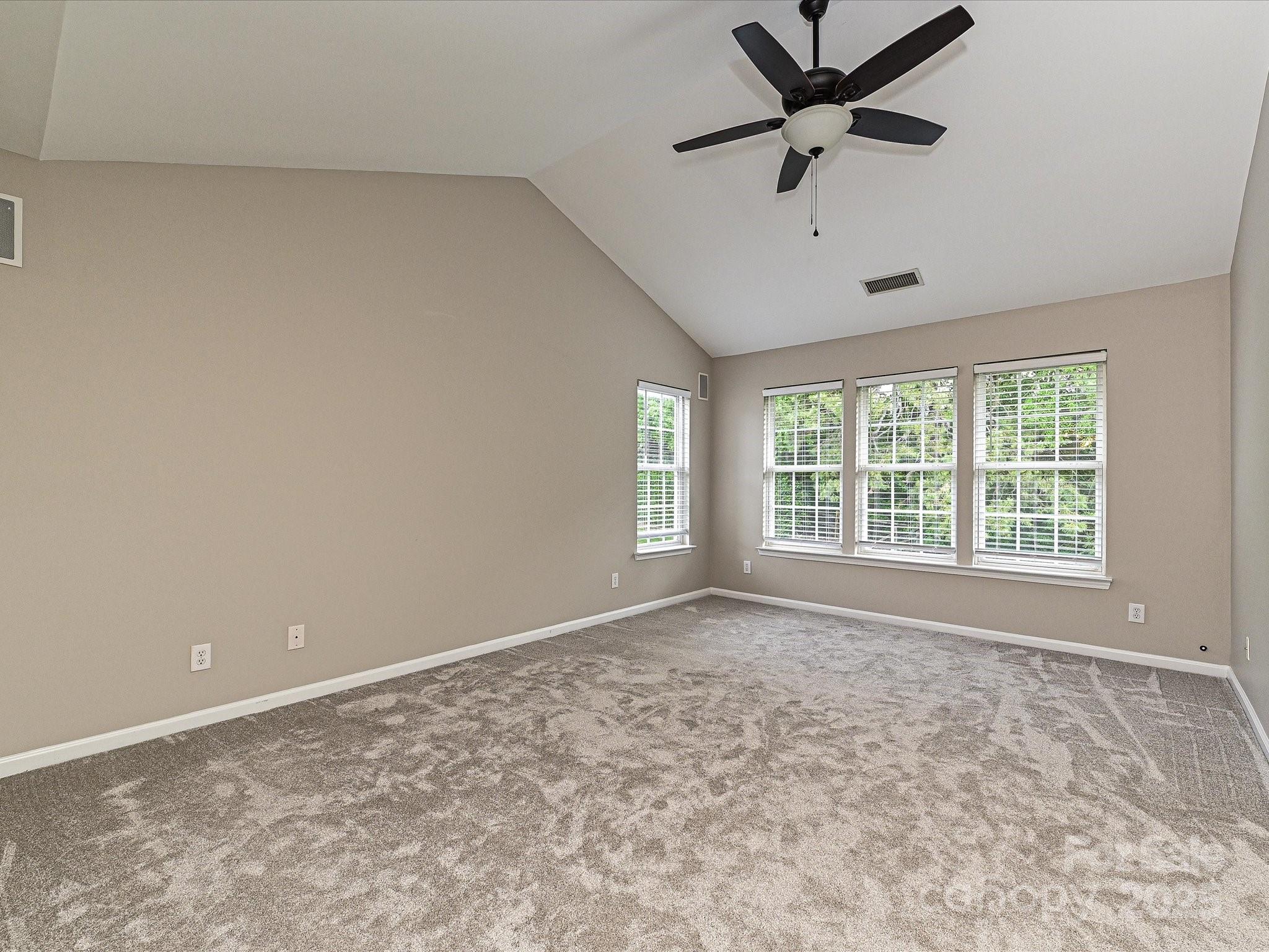 13237 Fremington Road Huntersville, NC 28078 - Photo 21 of 36 a view of an empty room with a window
