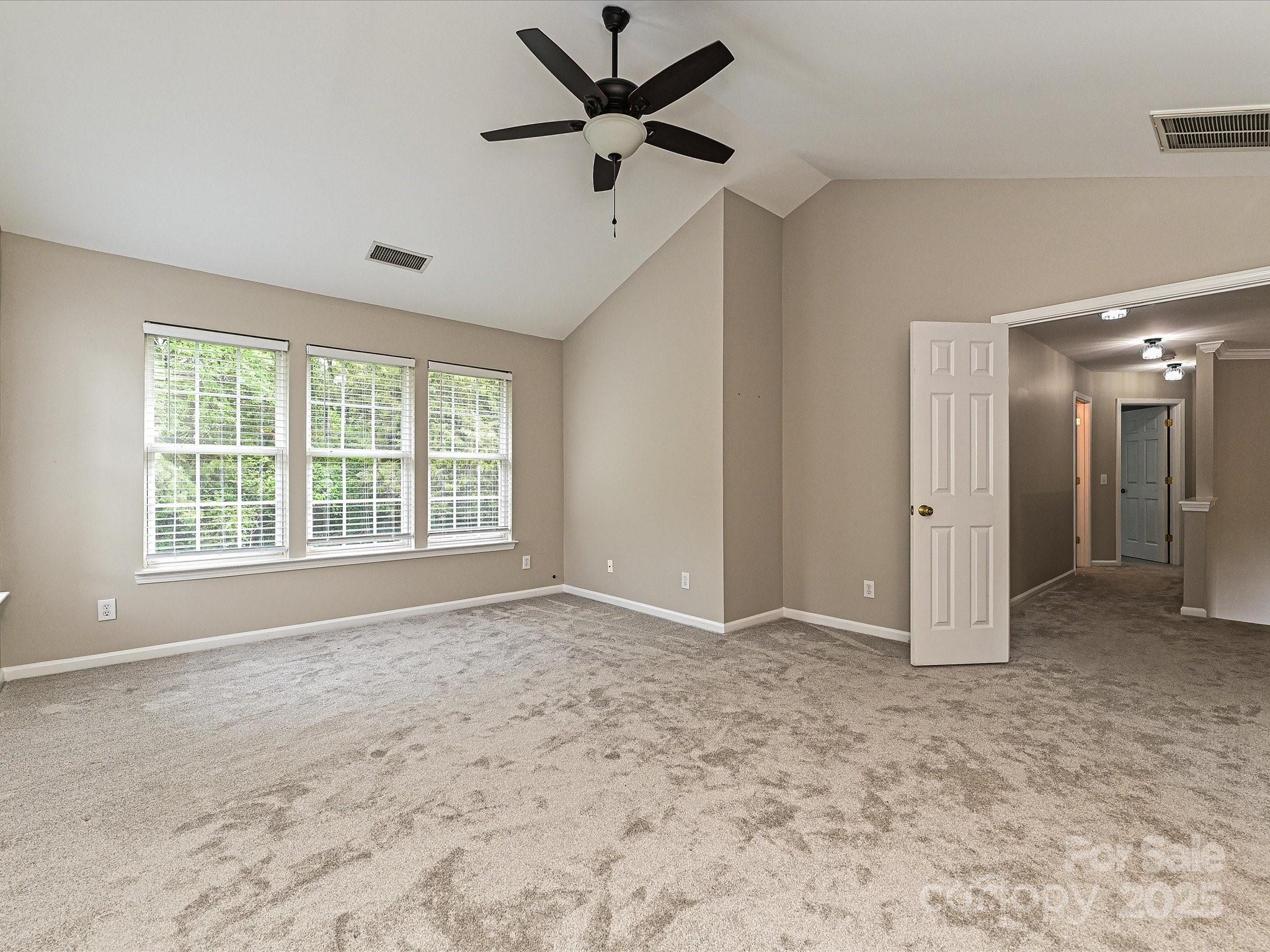 13237 Fremington Road Huntersville, NC 28078 - Photo 22 of 36 a view of an empty room with a window