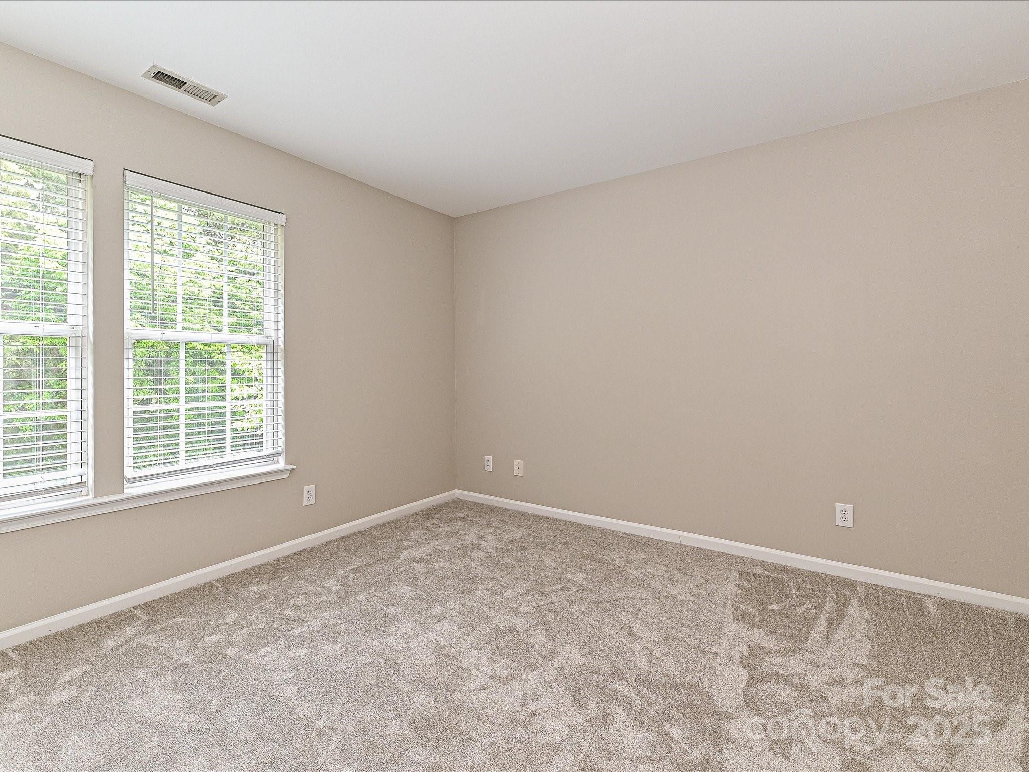 13237 Fremington Road Huntersville, NC 28078 - Photo 28 of 36 an empty room with a window