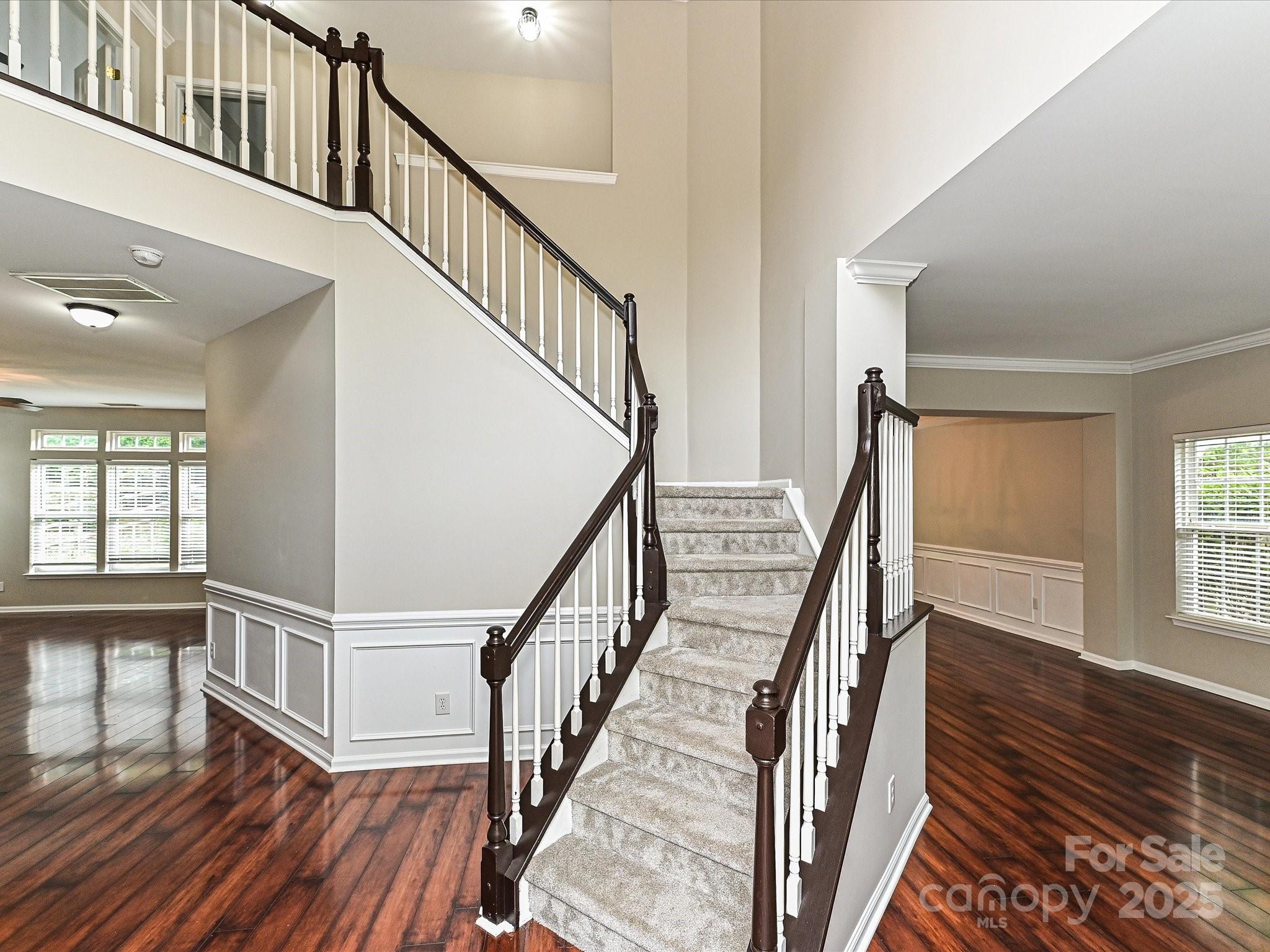 13237 Fremington Road Huntersville, NC 28078 - Photo 3 of 36 a view of staircase with wooden floor and a rug