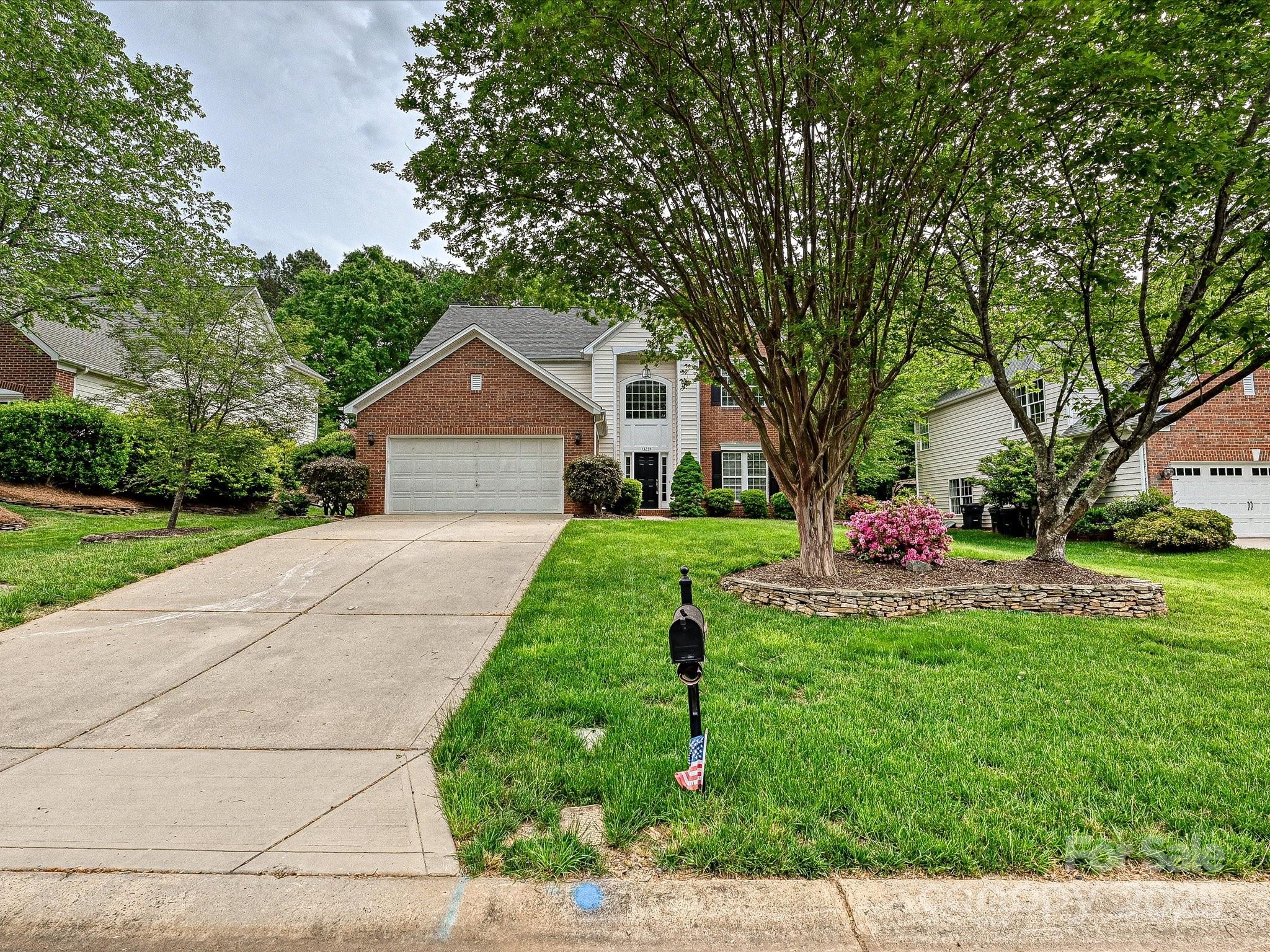 13237 Fremington Road Huntersville, NC 28078 - Photo 32 of 36 a front view of house with yard and green space