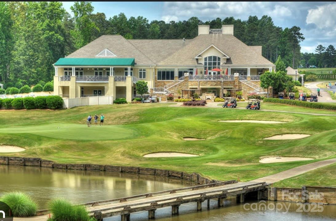 13237 Fremington Road Huntersville, NC 28078 - Photo 33 of 36 a front view of a house with swimming pool having outdoor seating