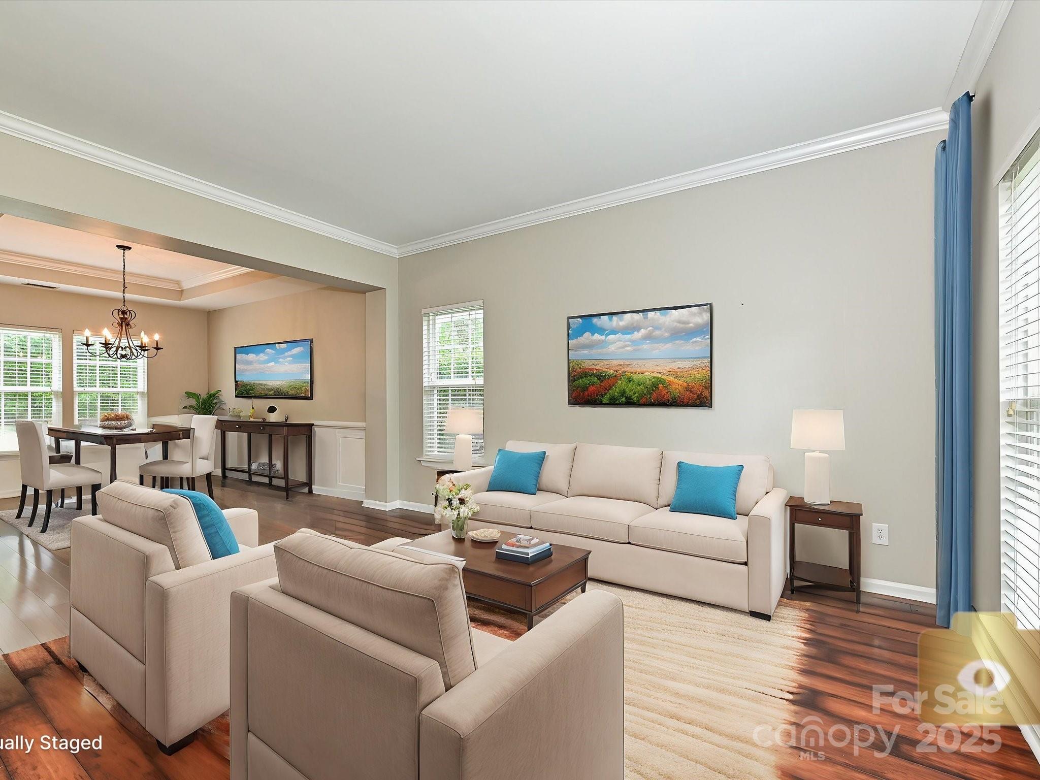 13237 Fremington Road Huntersville, NC 28078 - Photo 6 of 36 a living room with furniture and a flat screen tv