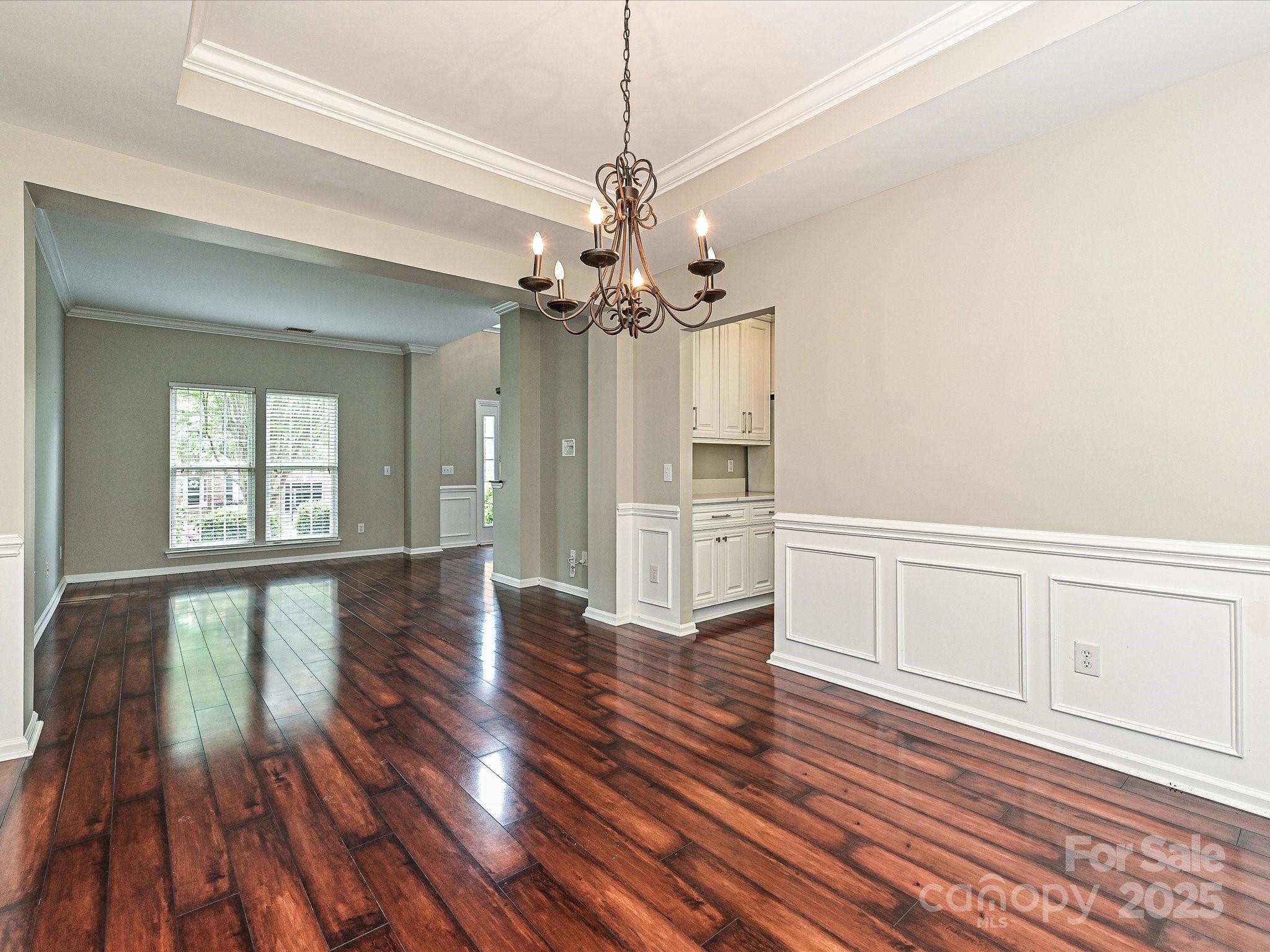 13237 Fremington Road Huntersville, NC 28078 - Photo 8 of 36 a view of an empty room with wooden floor and a window