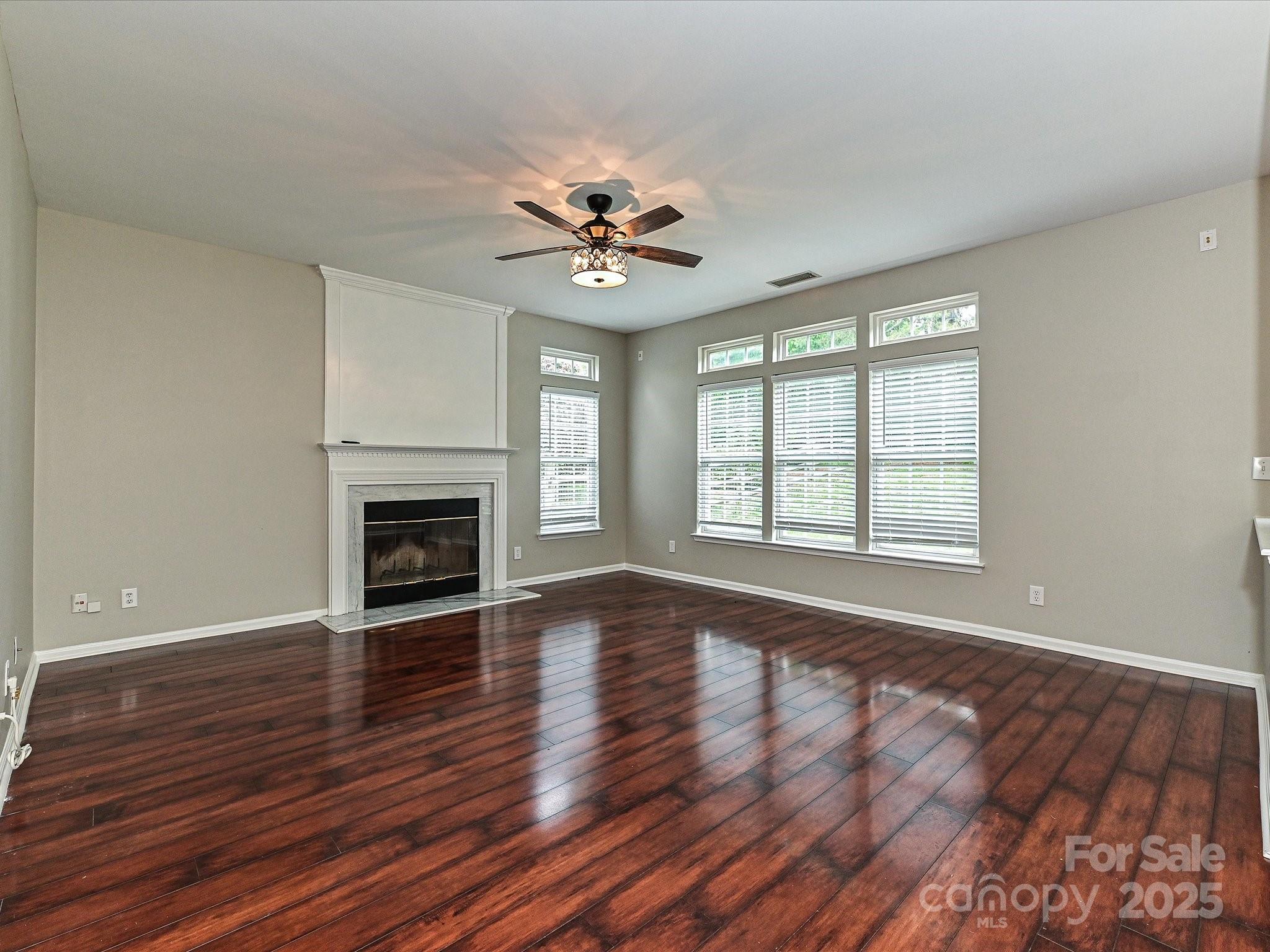 13237 Fremington Road Huntersville, NC 28078 - Photo 10 of 36 wooden floor chandelier and windows in a room