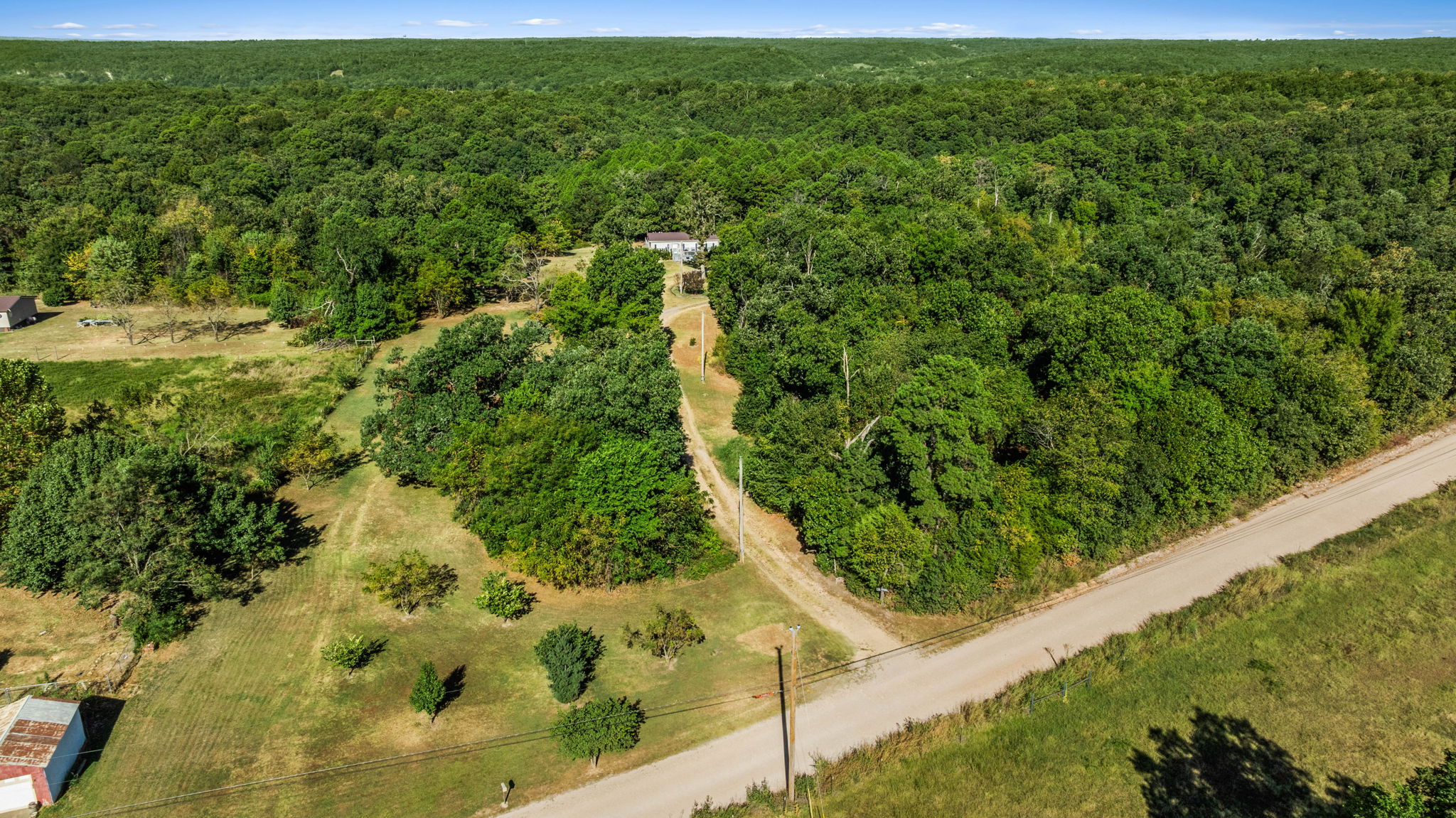 57443 667th Colcord, OK 74338 - Photo 39 of 51 Expansive wooded property featuring a natural landscape and a visible structure