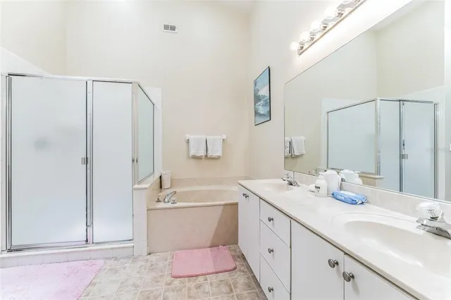 a bathroom with a double vanity sink mirror and double