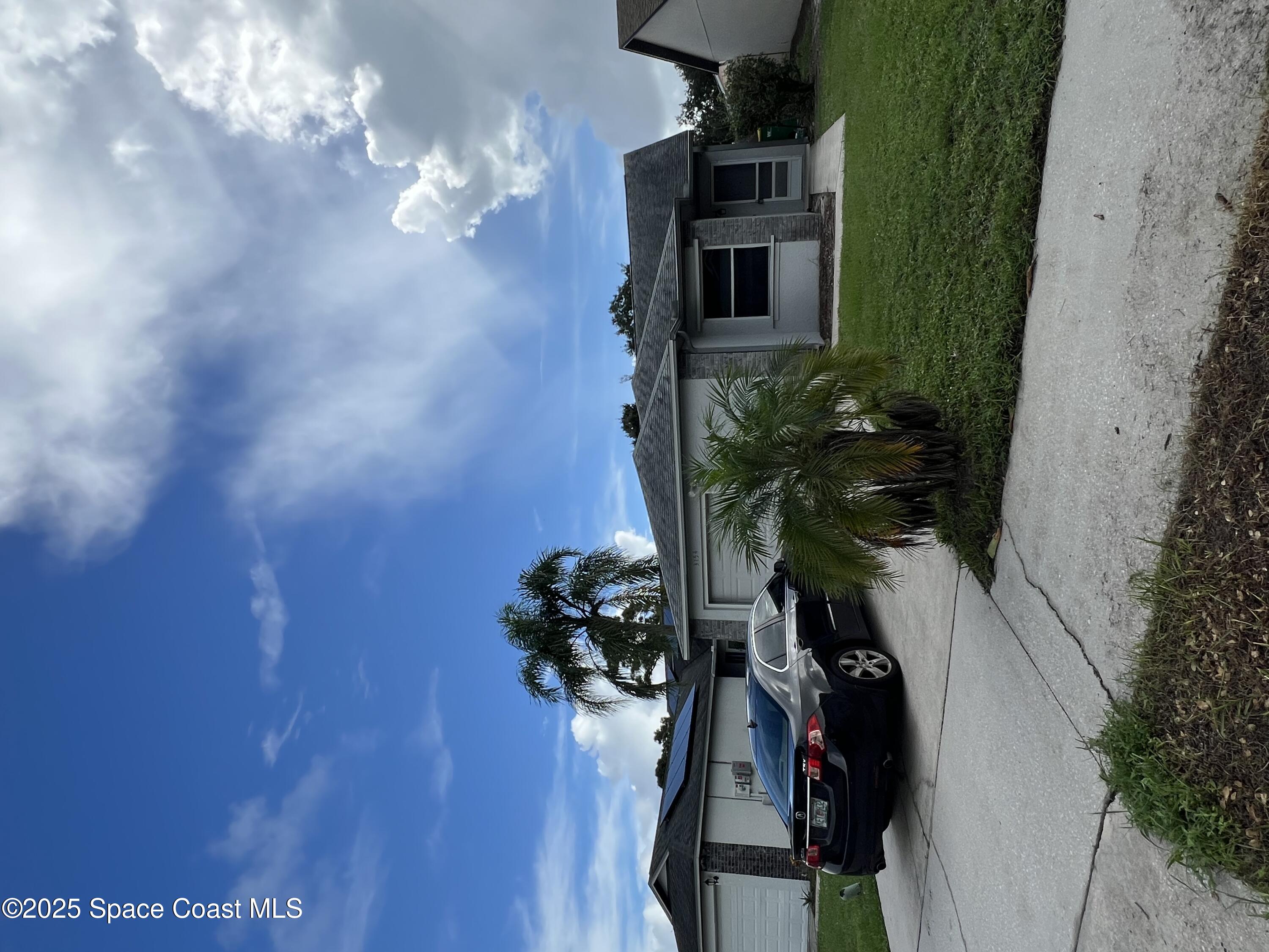 3154 Dunhill Drive Cocoa, FL 32926 - Photo 1 of 19 a car parked in front of a house