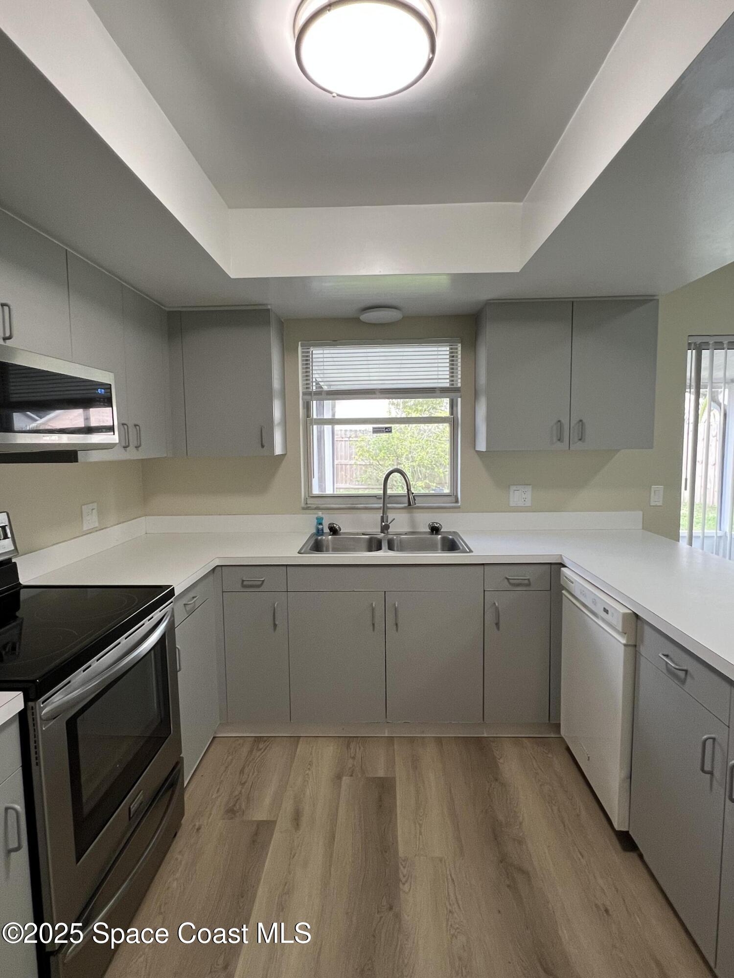 3154 Dunhill Drive Cocoa, FL 32926 - Photo 11 of 19 a kitchen with sink cabinets and window