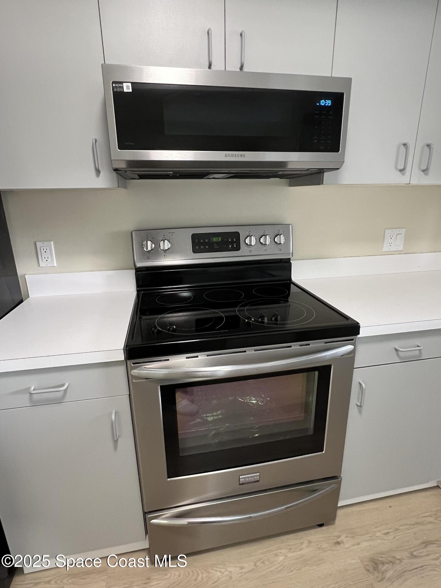 3154 Dunhill Drive Cocoa, FL 32926 - Photo 12 of 19 a stove top oven sitting inside of a kitchen