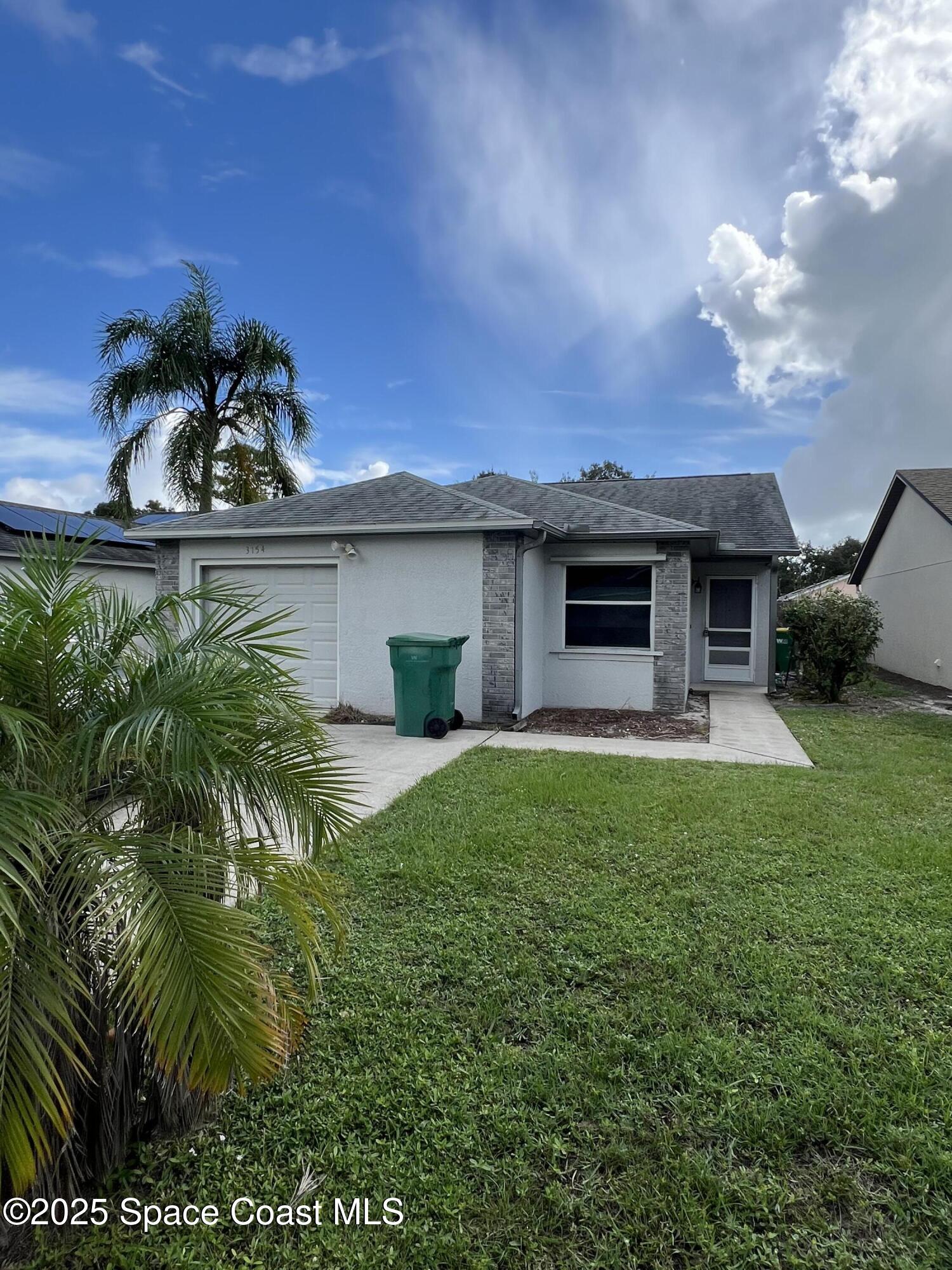 3154 Dunhill Drive Cocoa, FL 32926 - Photo 2 of 19 a view of a house with a backyard and porch