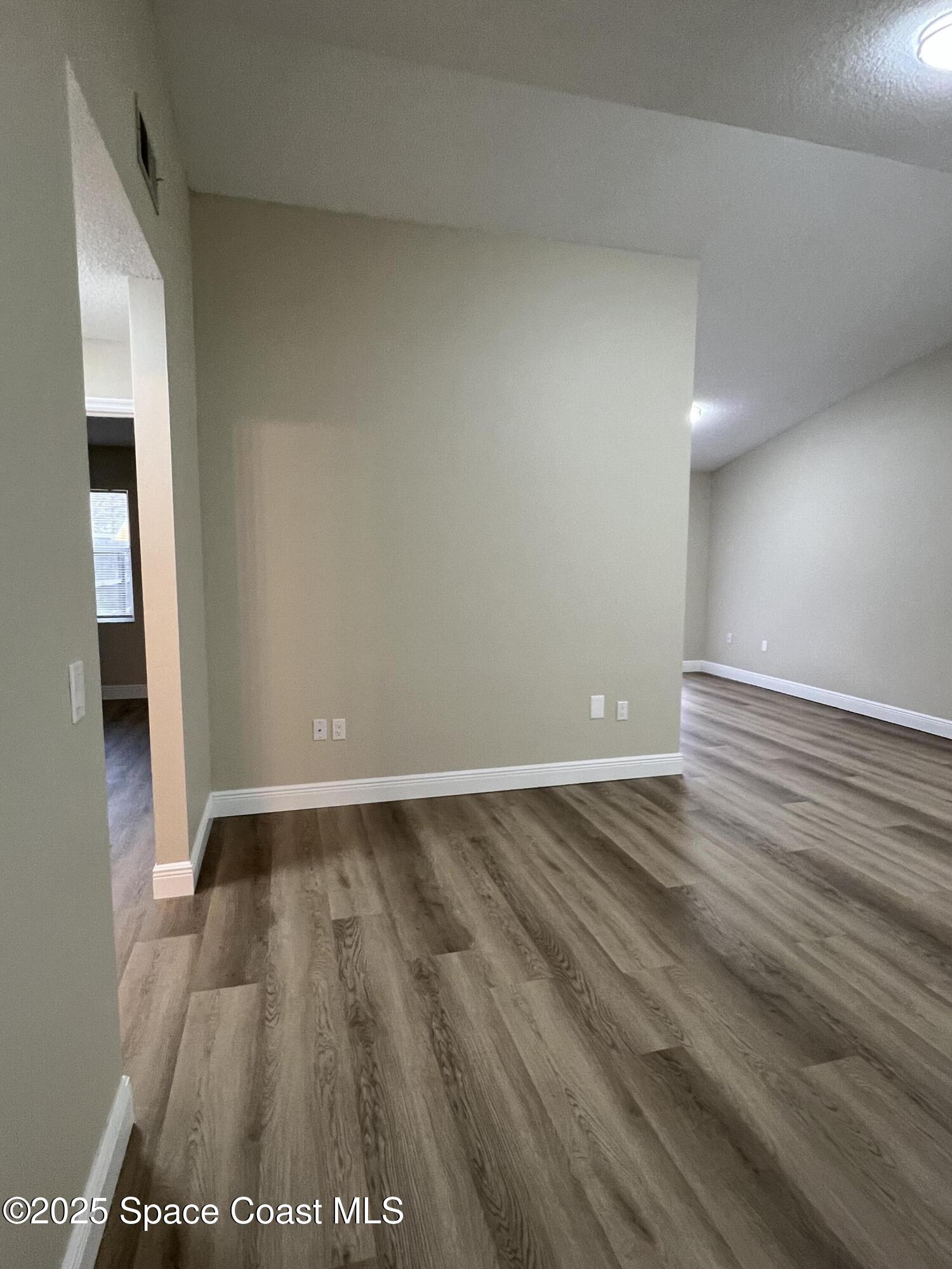 3154 Dunhill Drive Cocoa, FL 32926 - Photo 7 of 19 a view of an empty room and wooden floor