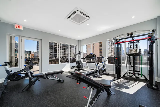 a view of a patio with table and chairs