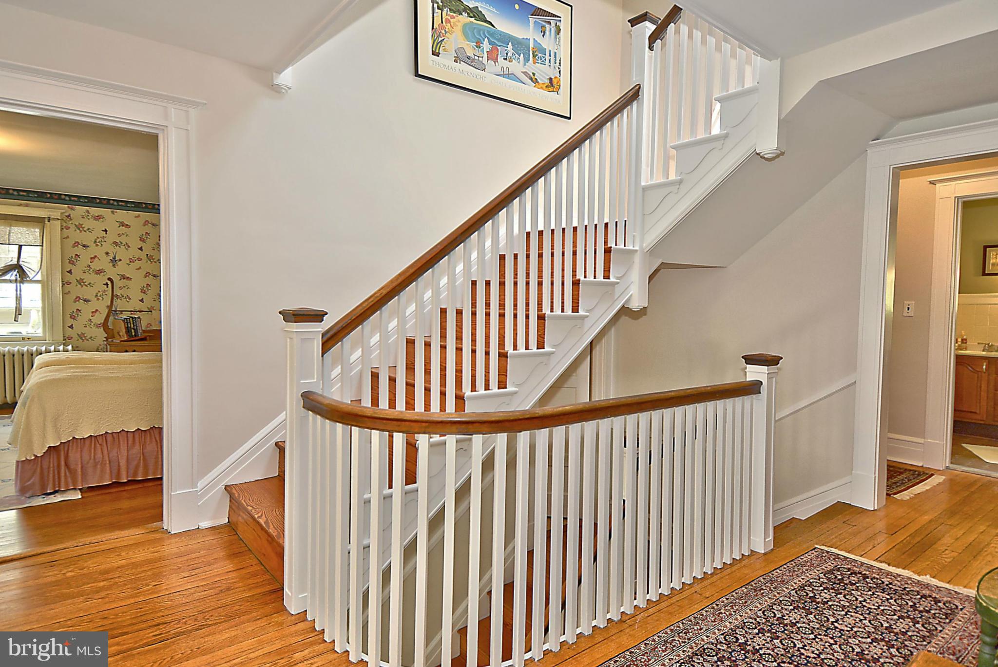 301 Edgevale Road Baltimore, MD 21210 - Photo 22 of 30 a view of staircase with wooden floor and a rug