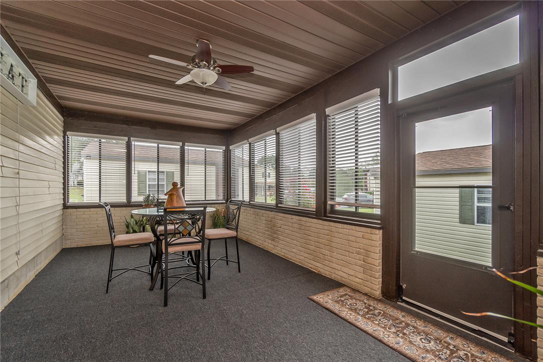 5728 Pheasant Road Bethlehem, PA 18017 - Photo 21 of 39 An enclosed porch provides a versatile space lined with numerous windows.
