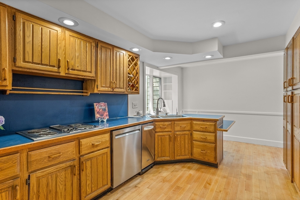 38 Wachusett Drive Lexington, MA 02421 - Photo 12 of 30 a kitchen with granite countertop wooden cabinets stainless steel appliances and a sink
