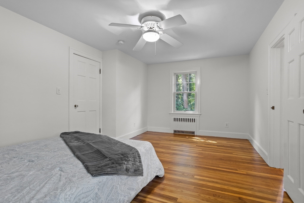 38 Wachusett Drive Lexington, MA 02421 - Photo 21 of 30 a bedroom with a bed and a window