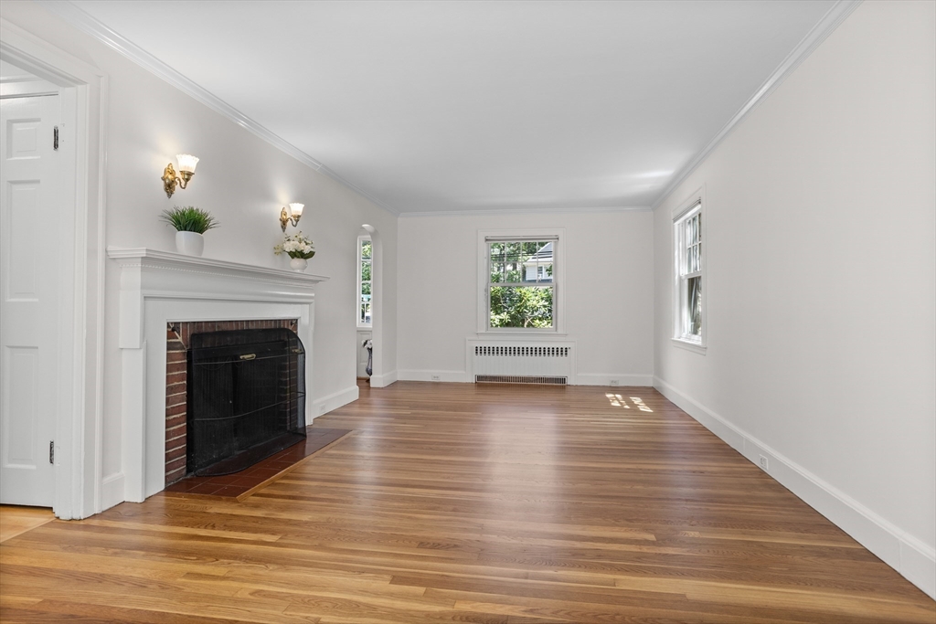 38 Wachusett Drive Lexington, MA 02421 - Photo 5 of 30 a view of an empty room with window and wooden floor