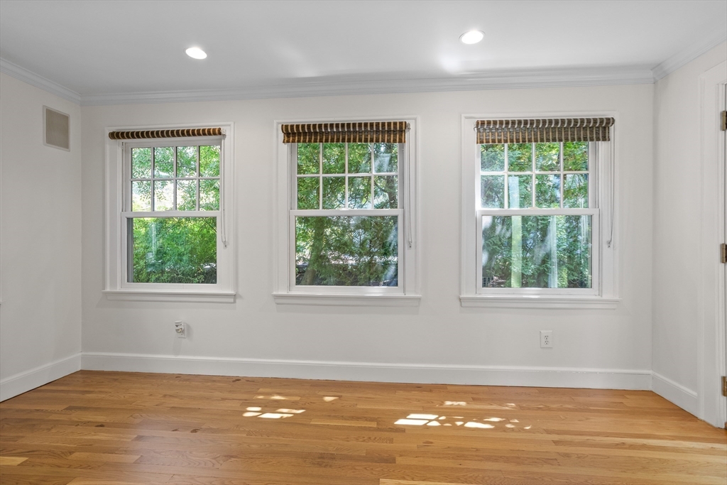 38 Wachusett Drive Lexington, MA 02421 - Photo 9 of 30 a view of an empty room with wooden floor and a window