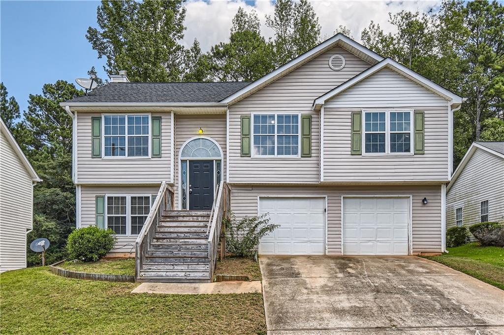 10968 Thrasher Road Hampton, GA 30228 - Photo 1 of 1 a front view of a house with a yard