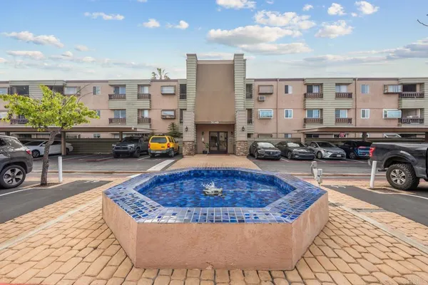 a swimming pool with outdoor seating