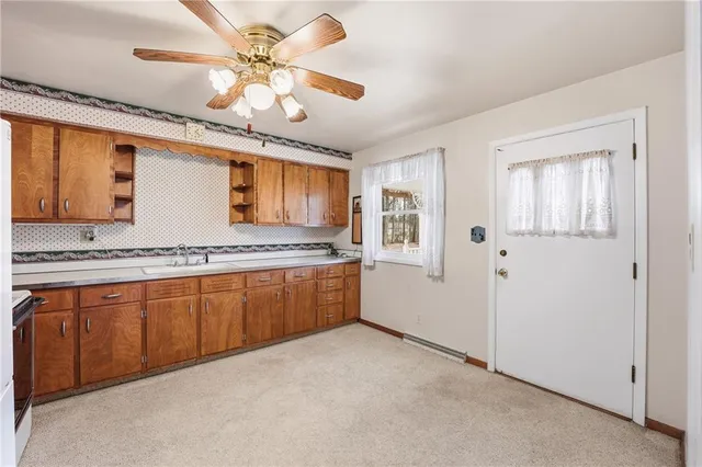 a spacious bathroom with a granite countertop sink and a mirror