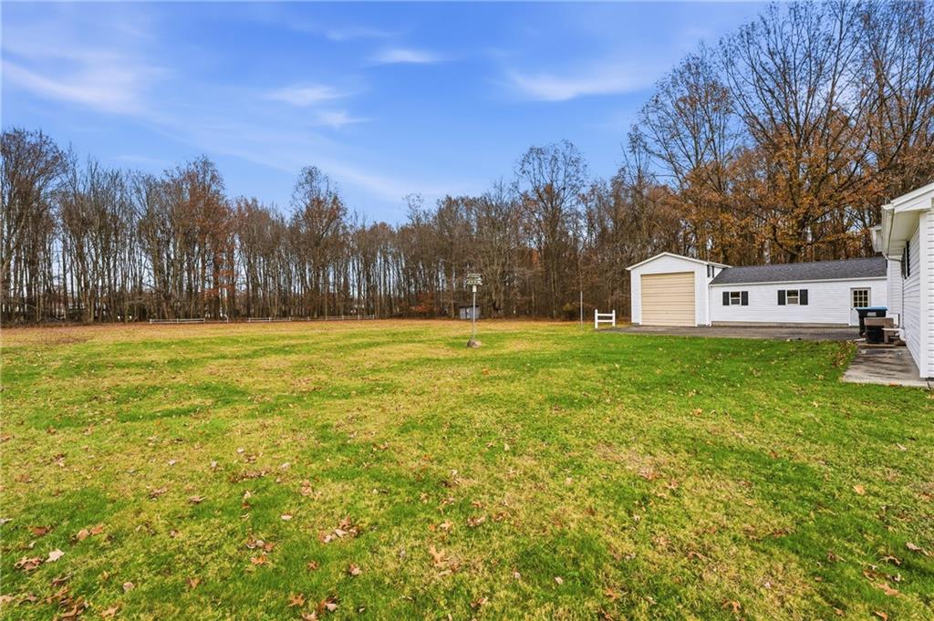 3489 Sample Road Hermitage, PA 16148 - Photo 18 of 33 a backyard of a house with table and chairs