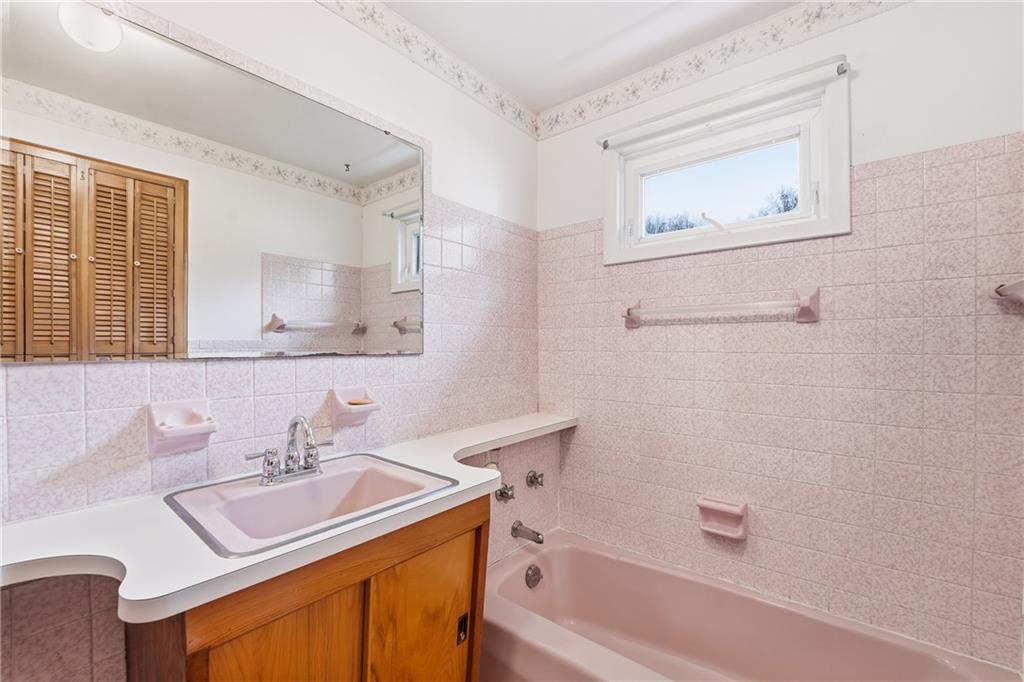 3489 Sample Road Hermitage, PA 16148 - Photo 23 of 33 a bathroom with a sink vanity tub and a mirror
