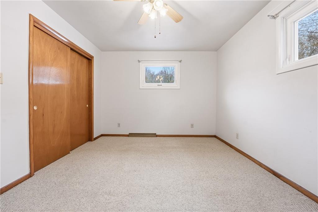 3489 Sample Road Hermitage, PA 16148 - Photo 25 of 33 an empty room with a window and ceiling fan