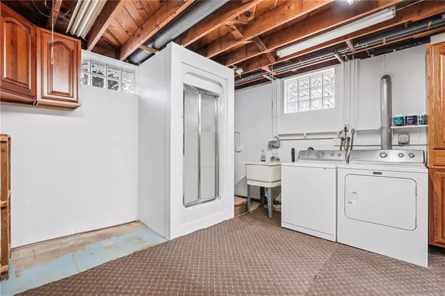 a view of a hallway with washer and dryer