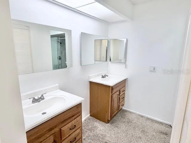 a utility room with cabinets washer and dryer
